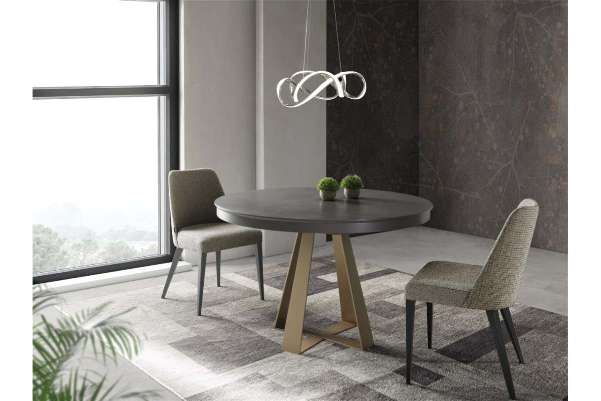 Mesa redonda extensible de comedor con diseño moderno tapa porcelánico modelo Delia de Indesan